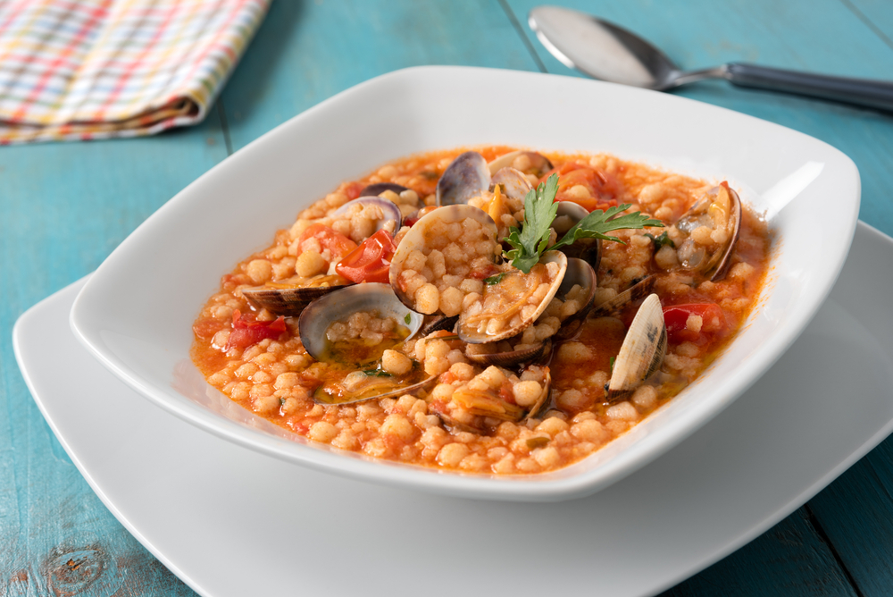 Plate,Of,Fregula,,A,Typical,Sardinian,Pasta,,With,Clams,And