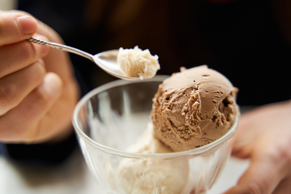 A,Girl,Is,Eating,Ice,Cream,In,A,Coffee,Shop