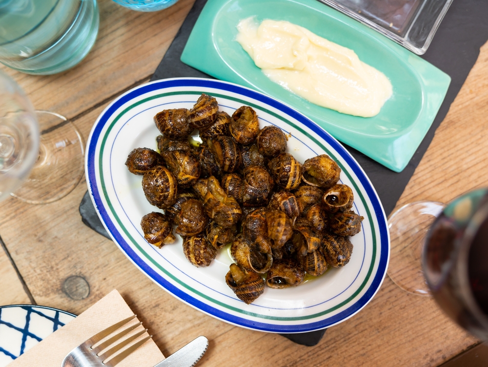 Cooked,In,Shells,Land,Snails,Served,On,Plate,With,Spicy