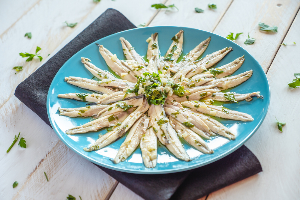 Pickled,Anchovies,With,Garlic,And,Parsley,Marinated,In,Vinegar,In