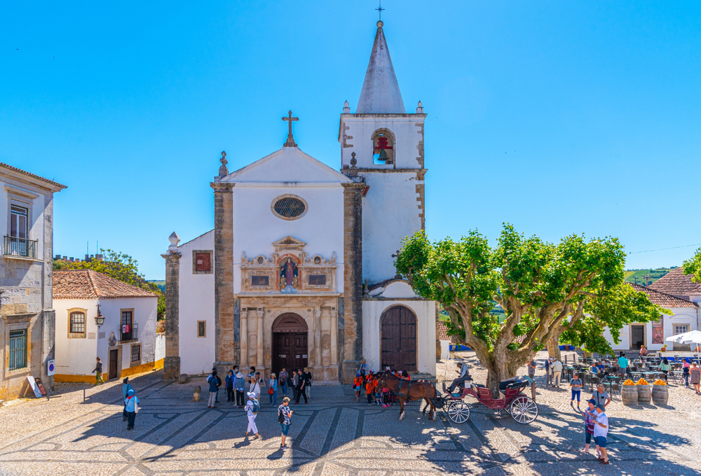 Obidos,,Portugal,,May,29,,2019:,People,Are,Strolling,In,Front