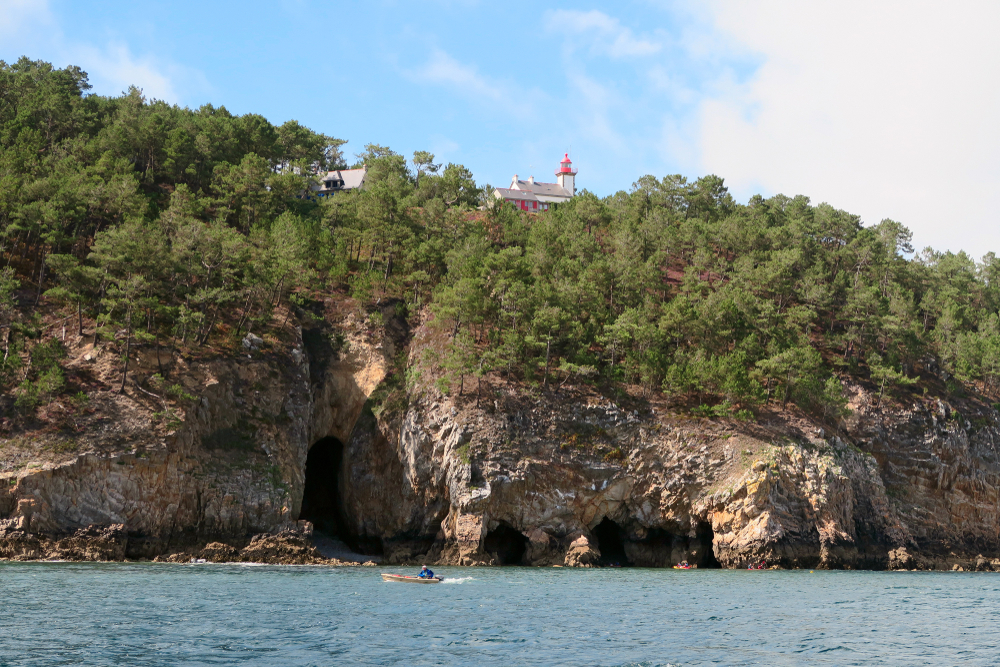 Lighthouse,On,The,Top,Of,Rock,With,Caves,At,The