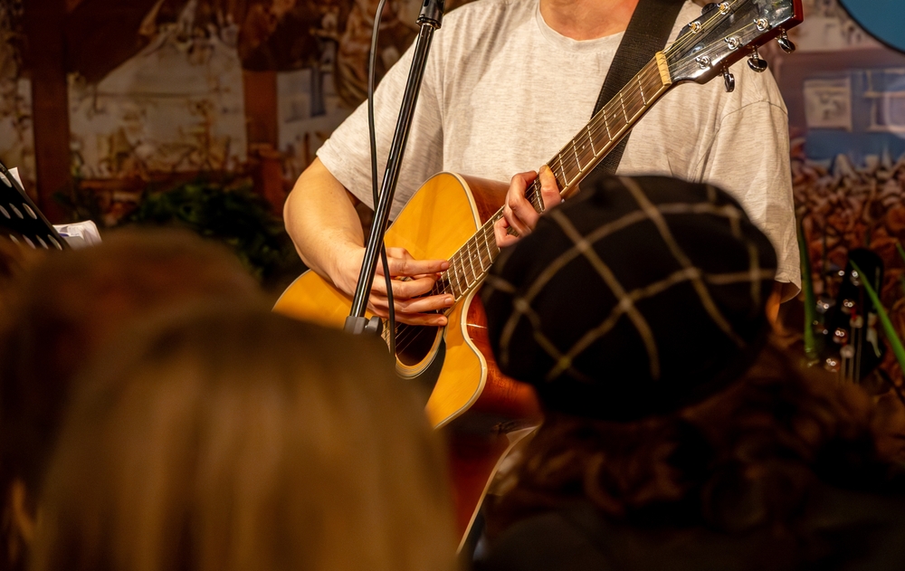A,Live,Music,Performance,With,A,Singer,Playing,Acoustic,Guitar