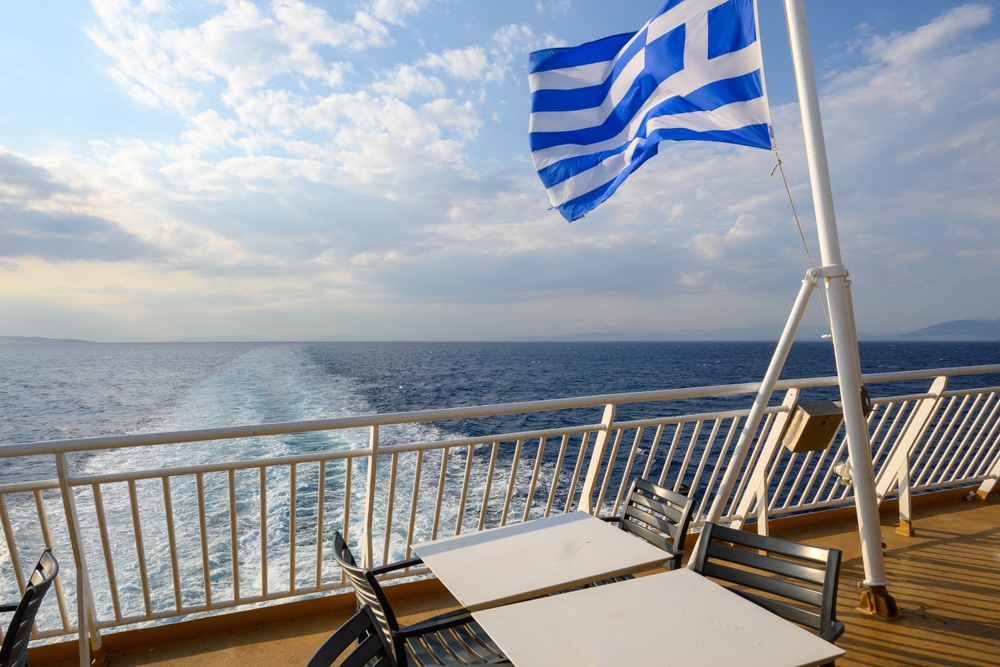 The,Greek,National,Flag,And,Water,Trail,Foaming,Behind,A