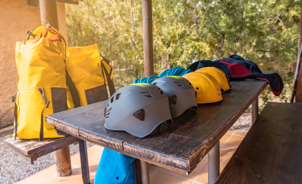 Canyoning,Material,Consisting,Of,Helmet,,Backpack,,Rope,And,Neoprene.,Horizontal